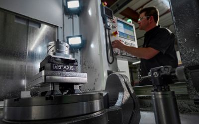 Final Frontier Manufacturing machinist using a 5-axis mill to produce aerospace parts